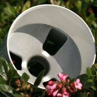 Aluminum white golf cup putting greens in a green grassy background