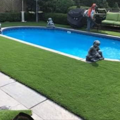 Artificial Grass Installed Over Concrete Around Swimming Pool