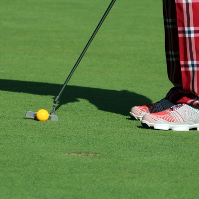 golf player on putting greens synthetic turf