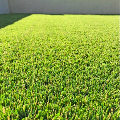 Backyard with Natural Stone Featuring Synthetic Grass