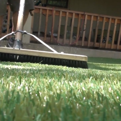 Brooming artificial turf installation