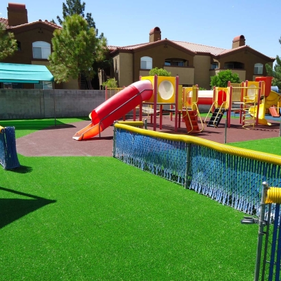 Playground surfacing or flooring, Sand, mulch, gravel, rubber, rubber tiles, mats, crumbs, artificial grass pros and cons, cost, safety, design. Green grass synthetic fake playground.