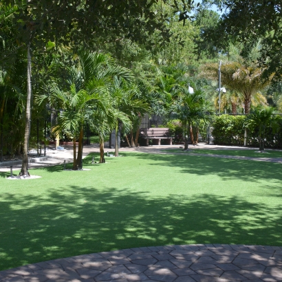 Green artificial grass synthetic turf installed on a big property park