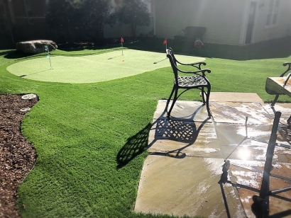 Private Backyard with Installed Putting Greens
