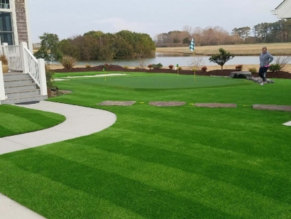Landscape made with putting green artificial grass by the lake in Carolina