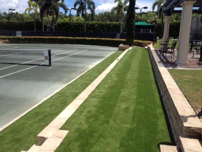 tennis court artificial grass installation, tennis ideas, green carpet outdoor, palm trees blue sky, concrete surface, stone