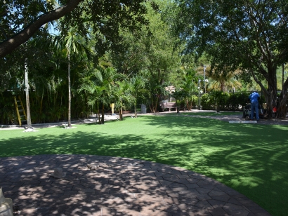 Synthetic lawn artificial grass turf lawn forest backyard landscaping ideas trees.