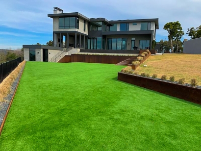 Texas synthetic turf installation, large front yard, two-story house