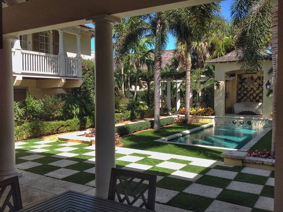 Patio deck design ideas. Swimming pool palm trees artificial grass chess checkered concrete backyard, covered porch.